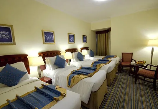 Room with 4 single beds