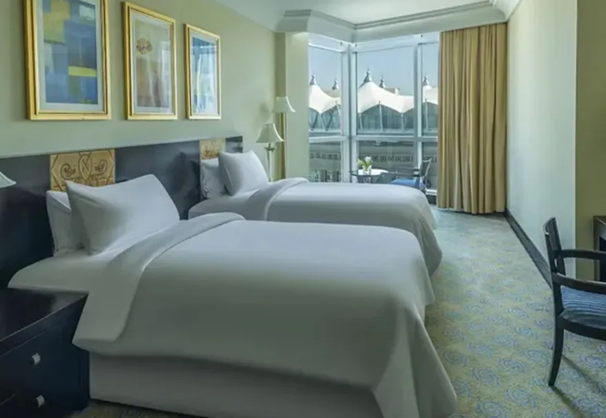 /media/umrah-images/2-single-beds-in-the-room%20%282%29.webp