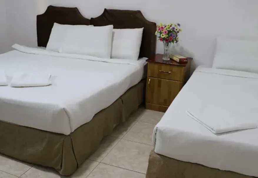 /media/umrah-images/2-single-beds-in-the-room%20%283%29.webp