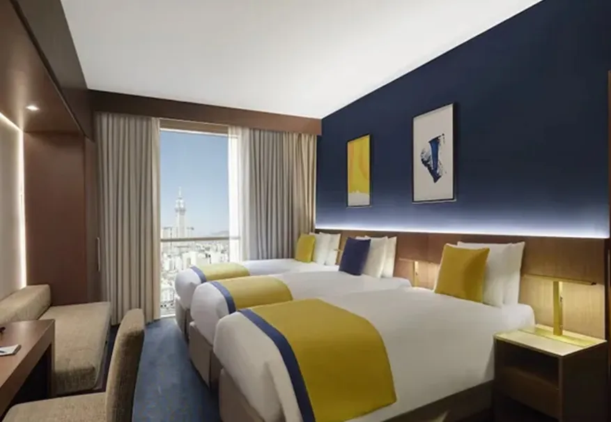 /media/umrah-images/room-with-3-single-beds%20%285%29.webp