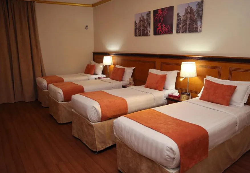 /media/umrah-images/room-with-4-single-bed.webp