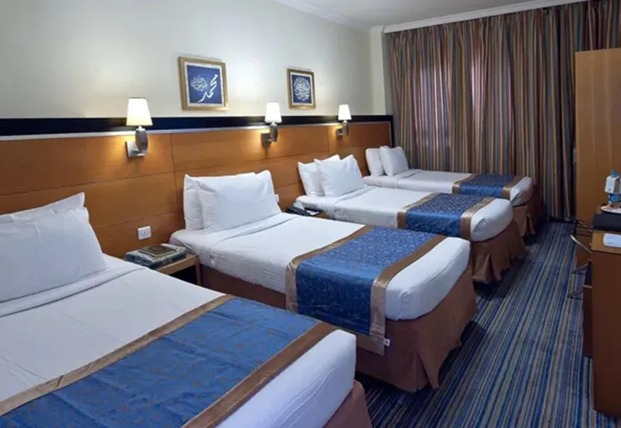 /media/umrah-images/room-with-4-single-beds%20%285%29.webp