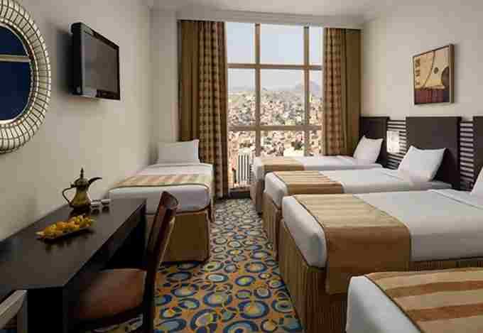 /media/umrah-images/room-with-5-single-beds.jpg