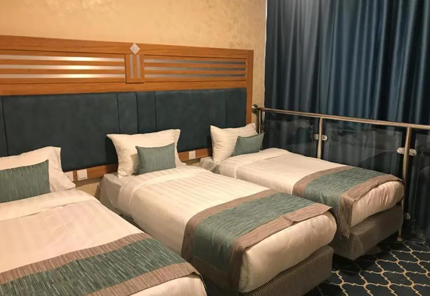 /media/umrah-images/three-beds-room.webp